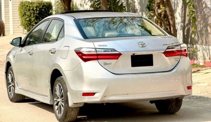 the white saloon car